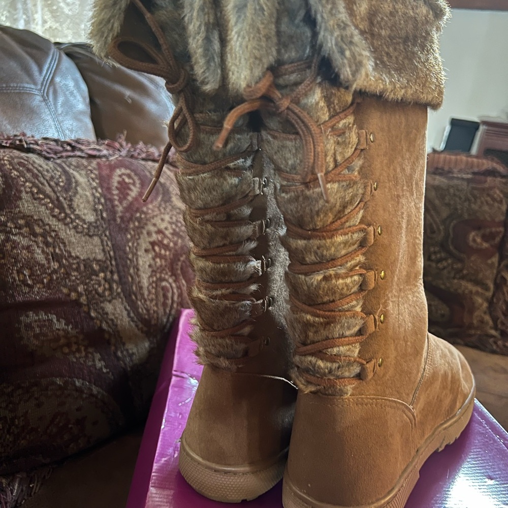Cold weather boots trimmed in fake fur